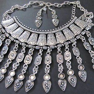 5 older Paparazzi silver necklace and earring sets